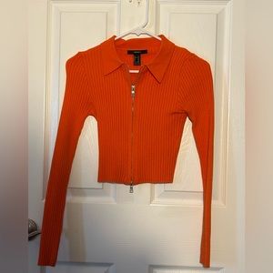 Bright orange cropped zip up sweater